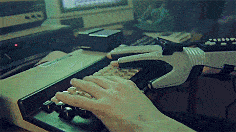 hands typing on a keyboard hacking into the mainframe