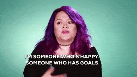 woman with purple hair saying I am someone whos happy, someone who has goals